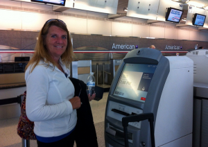 Lady using a Payment Kiosk 